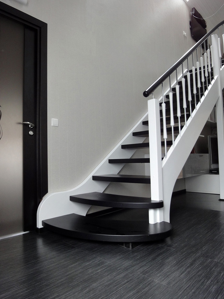 Inspiration for a medium sized contemporary wood straight staircase in Saint Petersburg with open risers.