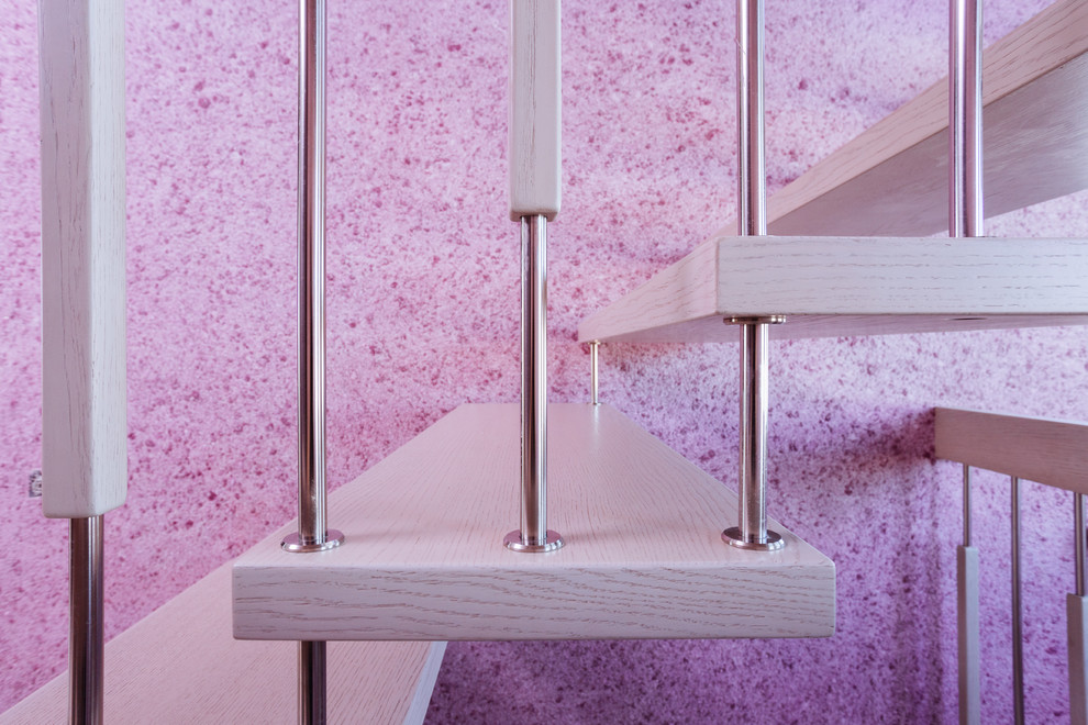 Inspiration pour un escalier flottant design de taille moyenne avec des marches en bois.