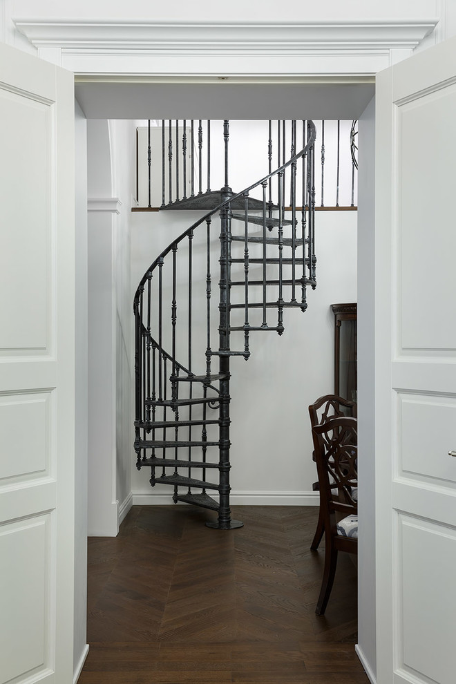 Design ideas for a small traditional metal spiral metal railing staircase in Saint Petersburg with open risers.