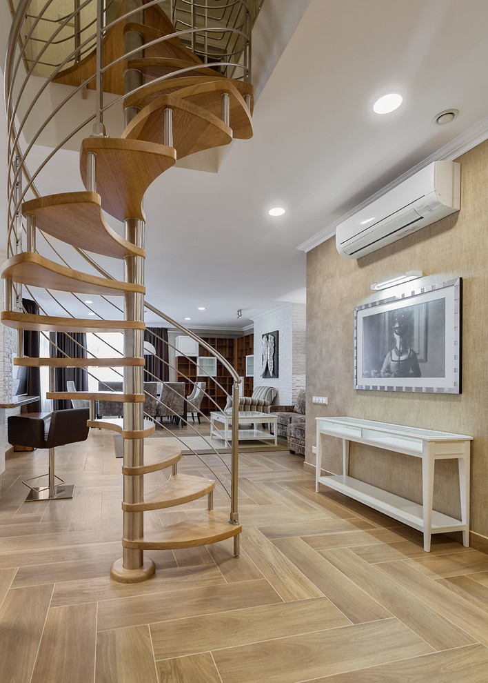 Inspiration pour un escalier sans contremarche hélicoïdal design avec des marches en bois et éclairage.