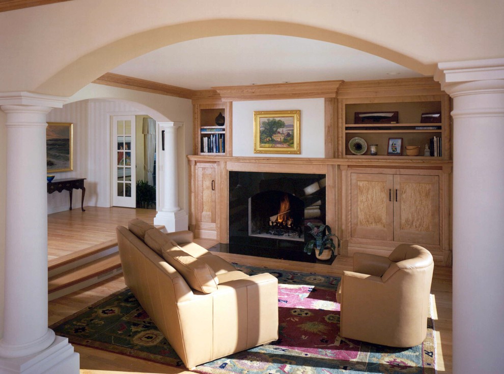 Photo of a medium sized classic open plan living room in Other with white walls, light hardwood flooring, a standard fireplace and a stone fireplace surround.