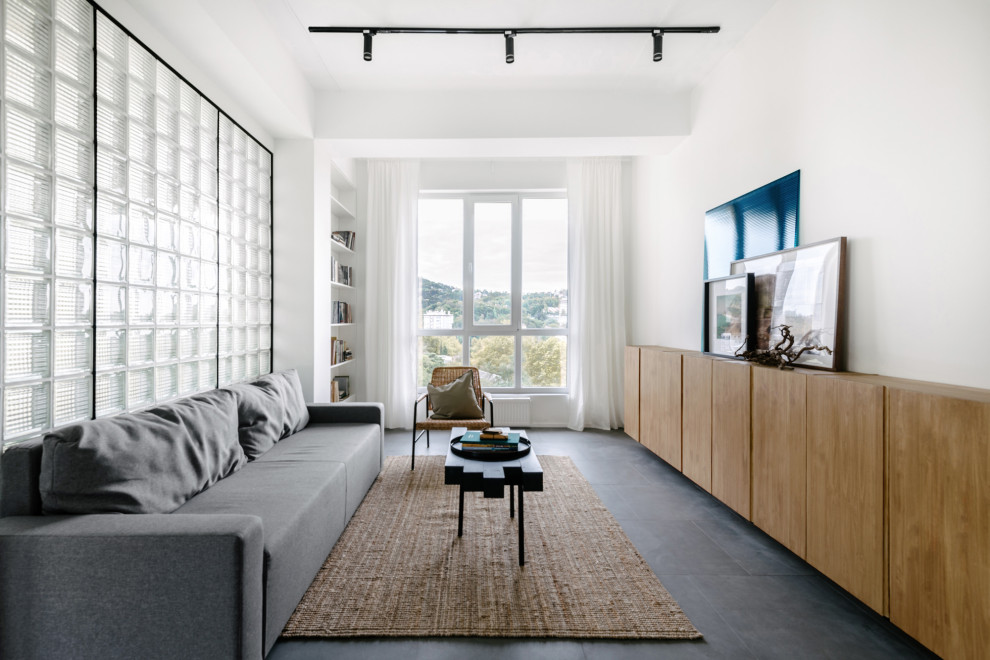 Источник вдохновения для домашнего уюта: гостиная комната среднего размера в современном стиле с белыми стенами и серым полом без телевизора