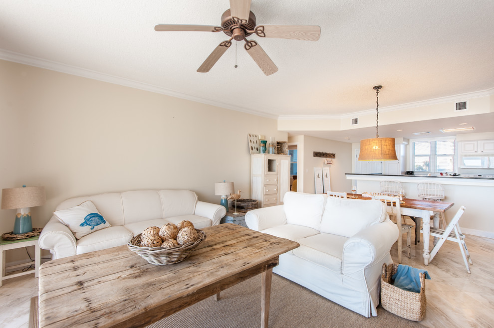 Beach style open concept living room photo in Miami with beige walls