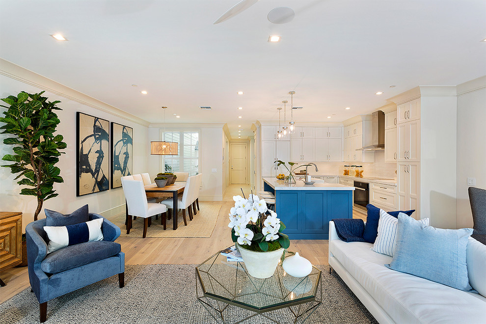 This is an example of a medium sized contemporary formal open plan living room in Miami with beige walls, light hardwood flooring, no fireplace, a wall mounted tv and beige floors.
