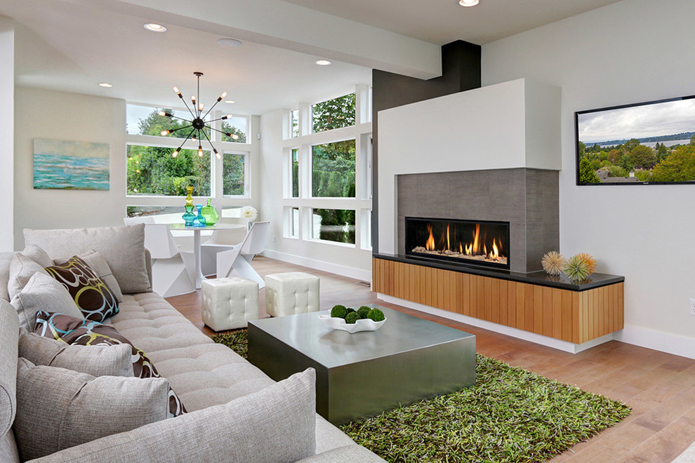 Design ideas for a contemporary open plan living room in Seattle with white walls, a ribbon fireplace and a wall mounted tv.
