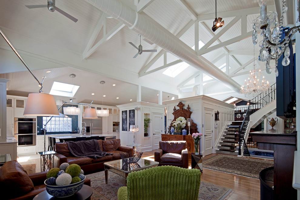 Example of a trendy open concept living room design in Toronto with white walls