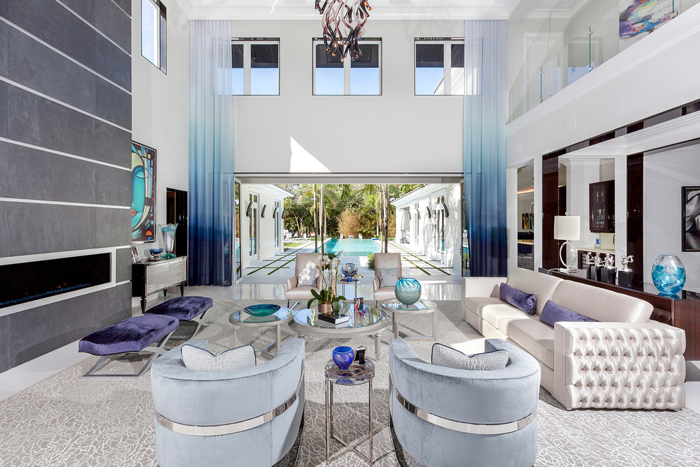 Inspiration for an expansive contemporary enclosed living room in Miami with white walls, porcelain flooring, a ribbon fireplace, a metal fireplace surround, no tv and white floors.