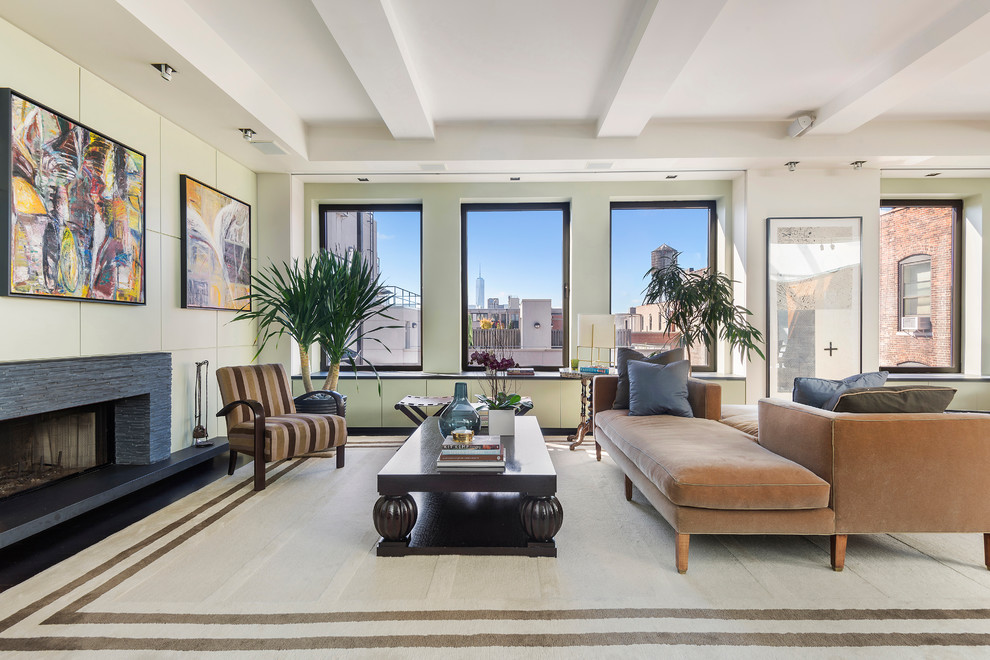 Photo of a large contemporary open plan living room in New York with beige walls, a stone fireplace surround, no tv and a ribbon fireplace.