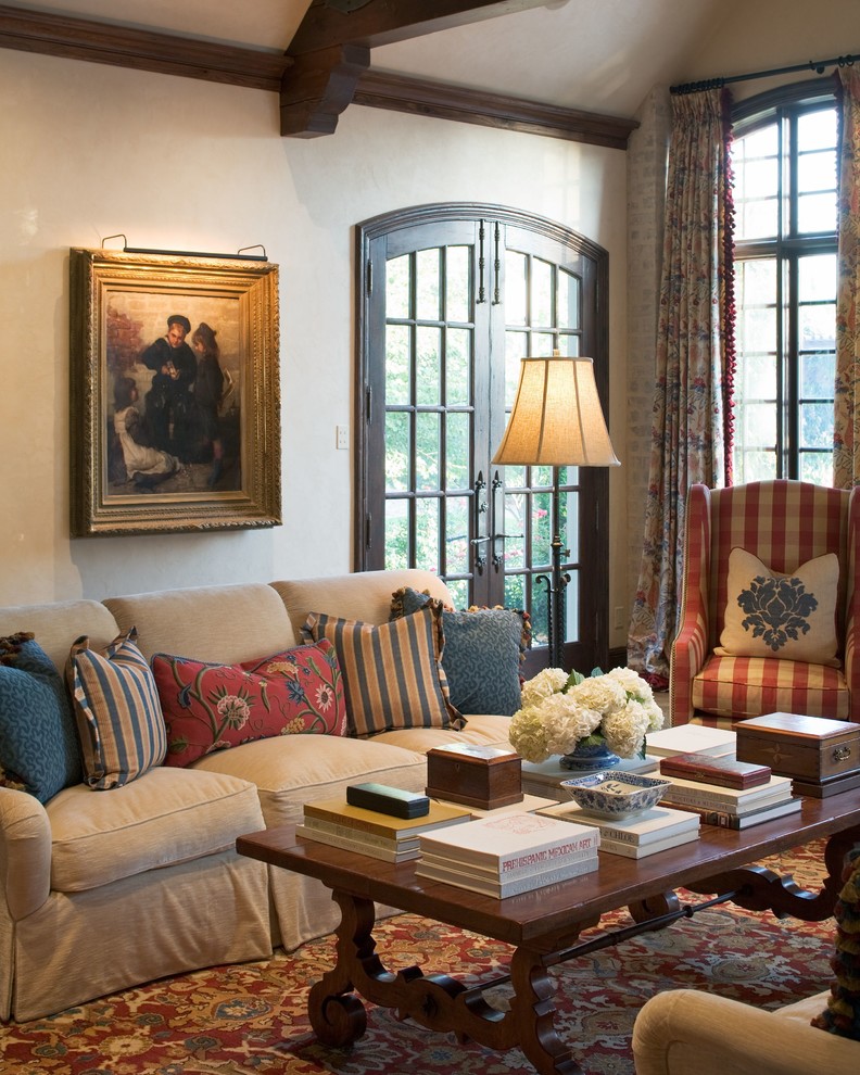 Tuscan enclosed living room photo in Wichita with beige walls