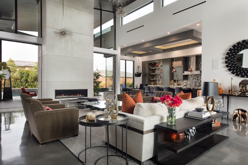 Inspiration for a contemporary formal and open concept concrete floor and gray floor living room remodel in Las Vegas with white walls, a ribbon fireplace, a concrete fireplace and no tv