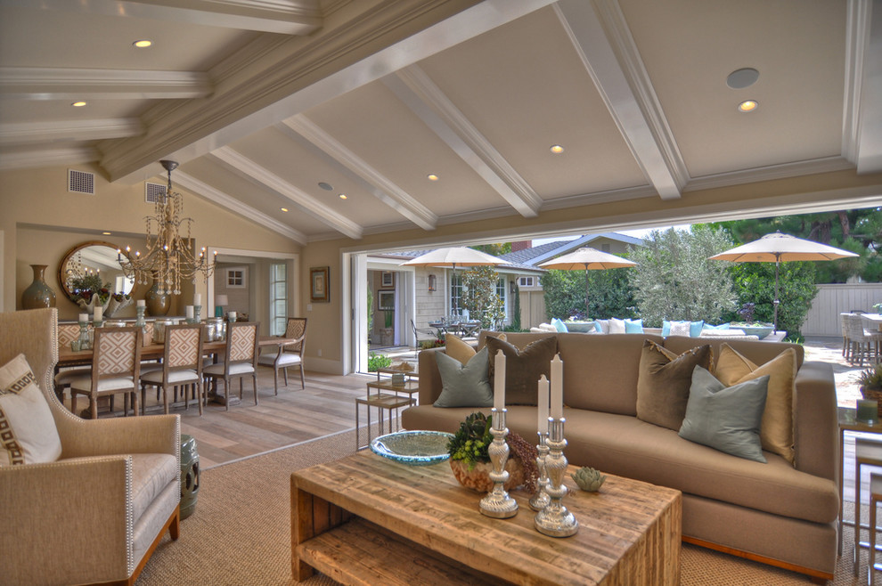 Beach style open concept living room photo in Los Angeles with beige walls