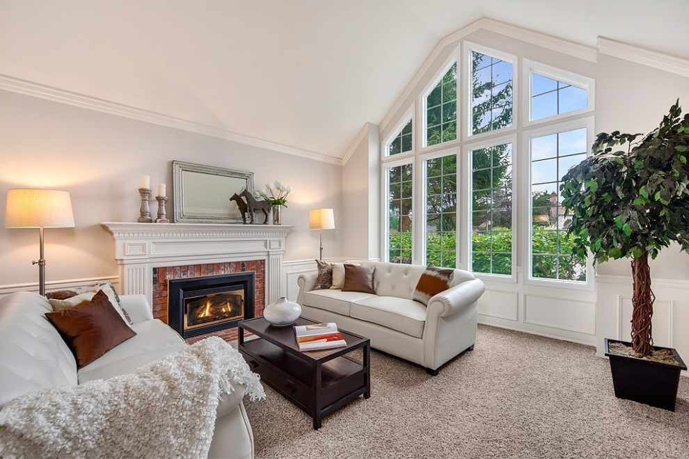 Example of a large transitional formal carpeted and beige floor living room design in Other with gray walls, a standard fireplace, a brick fireplace and no tv