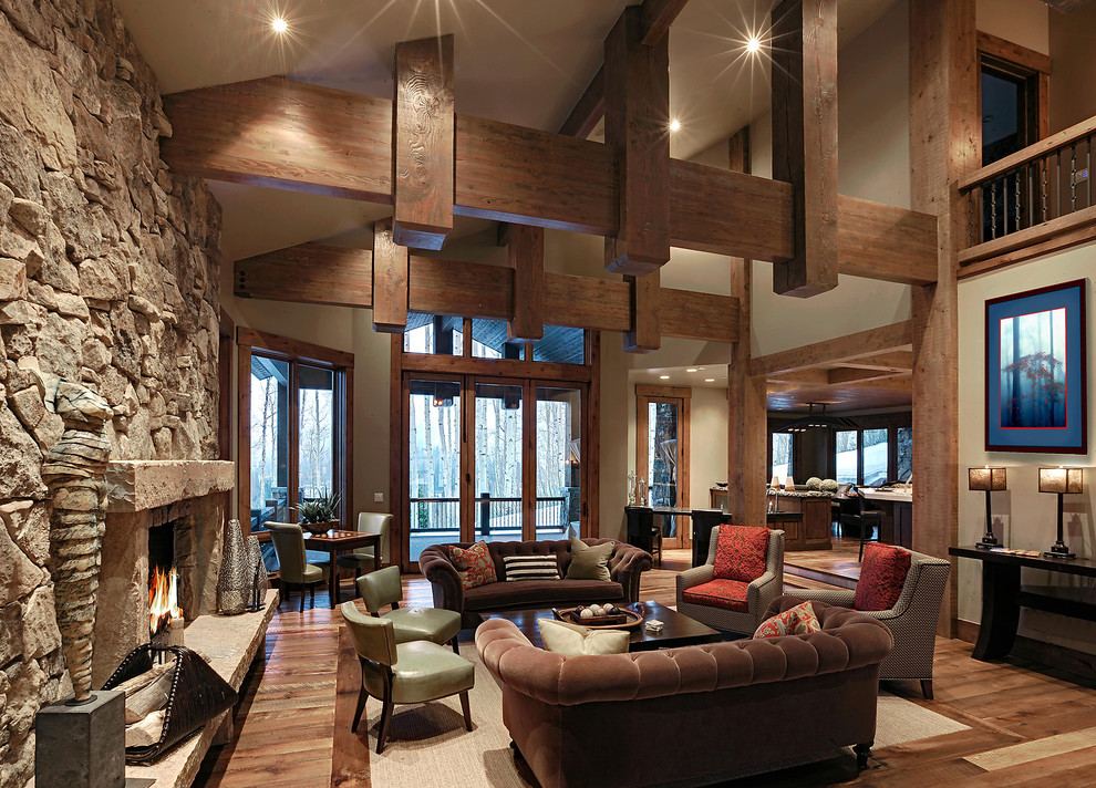 Inspiration for a rustic living room remodel in Salt Lake City with a standard fireplace and a stone fireplace