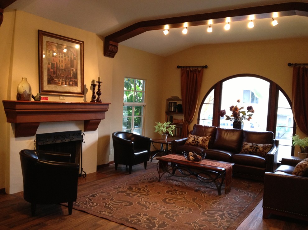 Living room - traditional living room idea in Los Angeles with a standard fireplace and a plaster fireplace