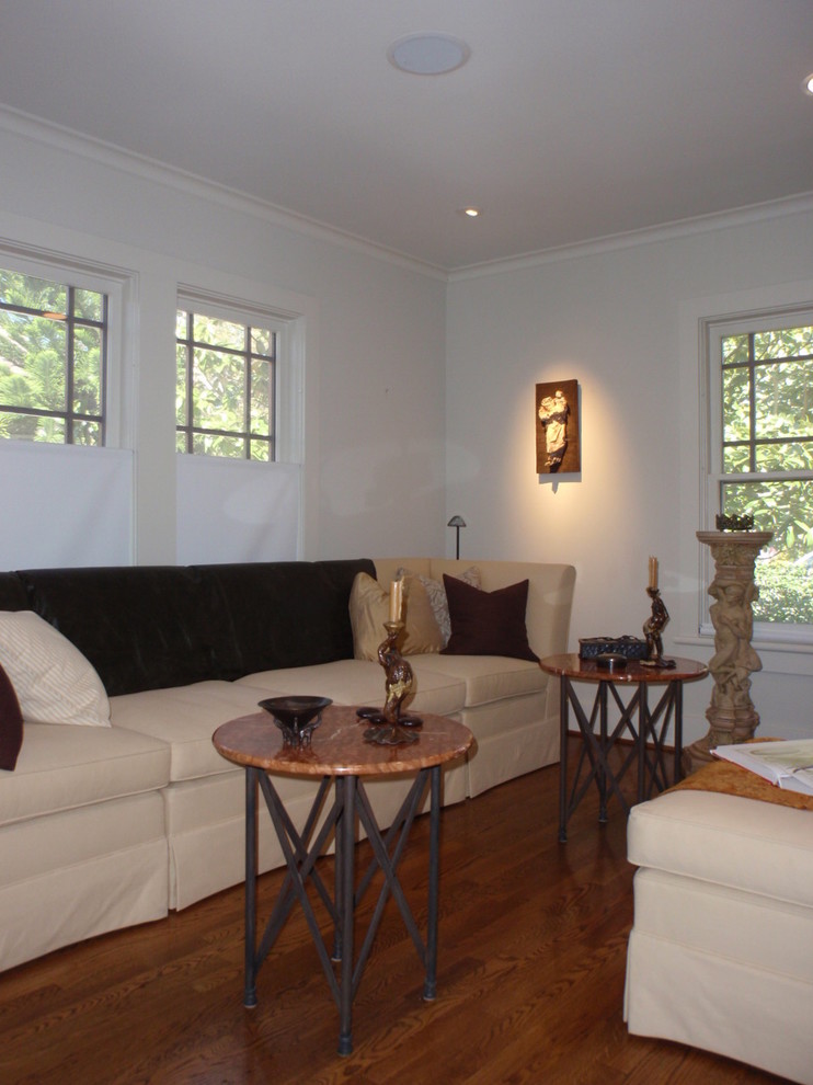 Medium sized classic formal enclosed living room in Houston with light hardwood flooring.