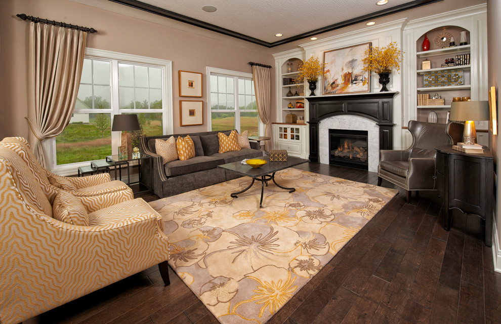 Example of a large classic formal and open concept medium tone wood floor living room design in Columbus with gray walls, a standard fireplace, a stone fireplace and no tv