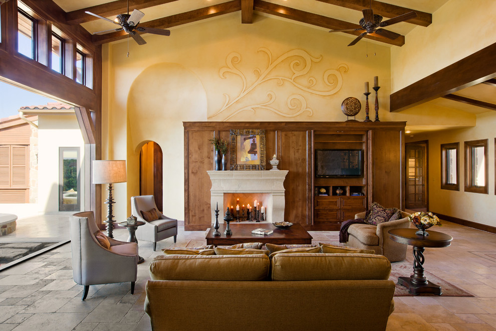 Living room - huge mediterranean formal and open concept travertine floor living room idea in Austin with beige walls, a standard fireplace, a stone fireplace and a concealed tv