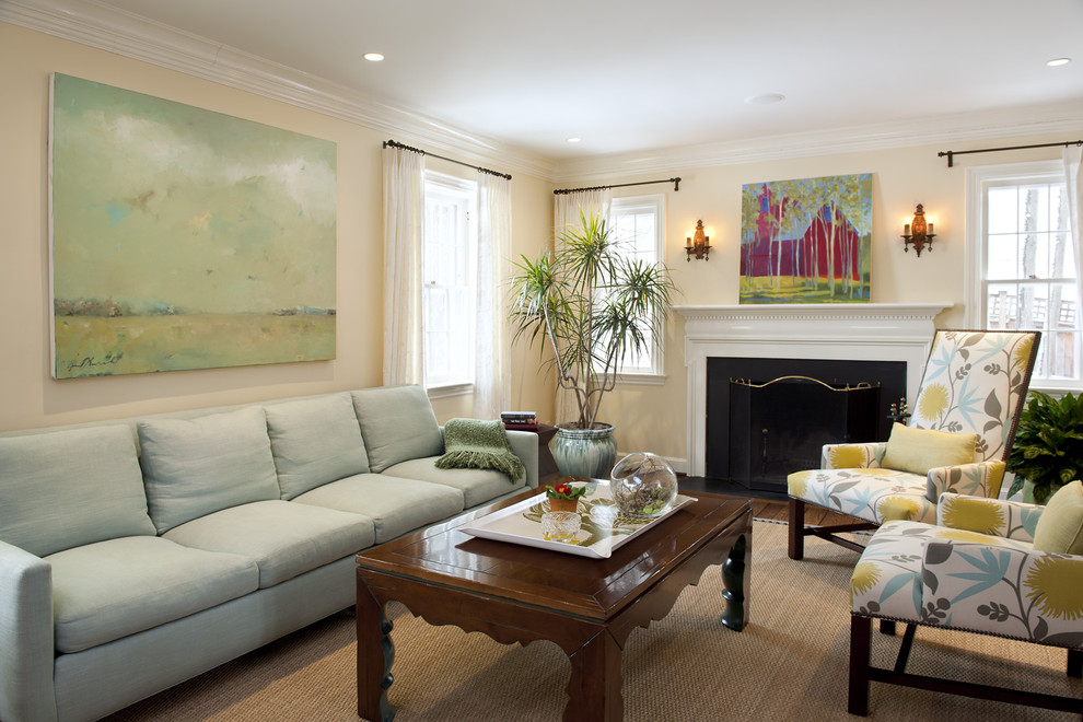 Traditional formal enclosed living room in DC Metro with beige walls and a standard fireplace.