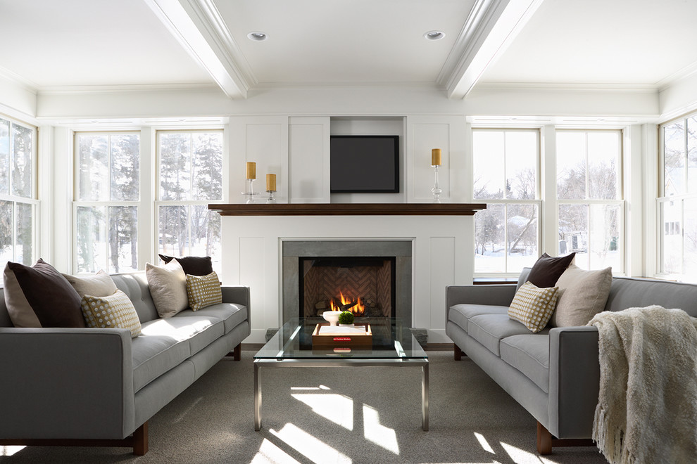 Trendy living room photo in Minneapolis with a concealed tv