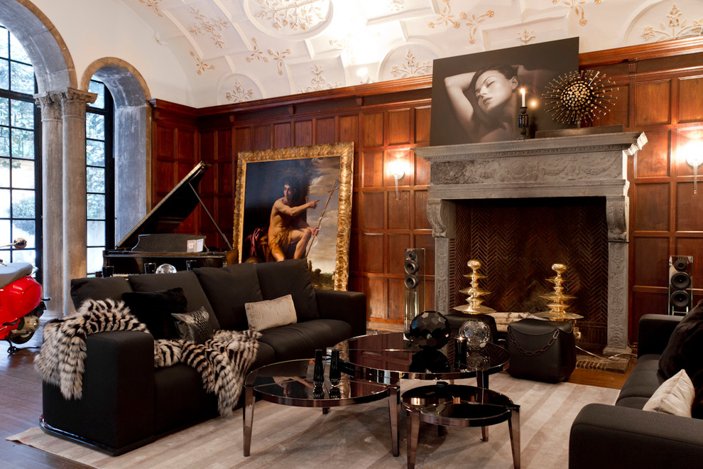 Стильный дизайн: гостиная комната в современном стиле с музыкальной комнатой, темным паркетным полом и стандартным камином - последний тренд