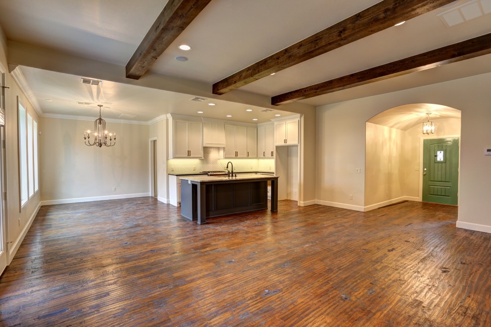 Large transitional enclosed dark wood floor living room photo in Oklahoma City with beige walls