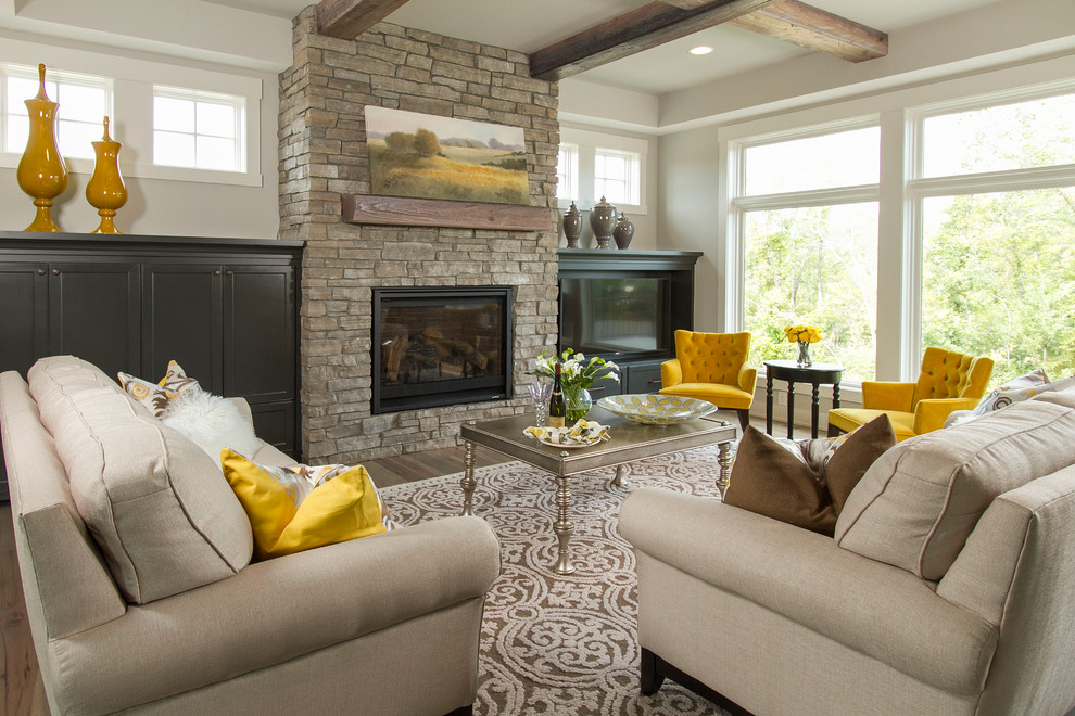 Living room - mid-sized transitional formal and enclosed carpeted and multicolored floor living room idea in Minneapolis with beige walls, a standard fireplace, a stone fireplace and a media wall