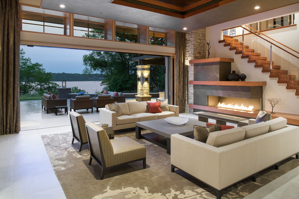 Huge trendy open concept and formal porcelain tile living room photo in Minneapolis with a ribbon fireplace, a stone fireplace and white walls