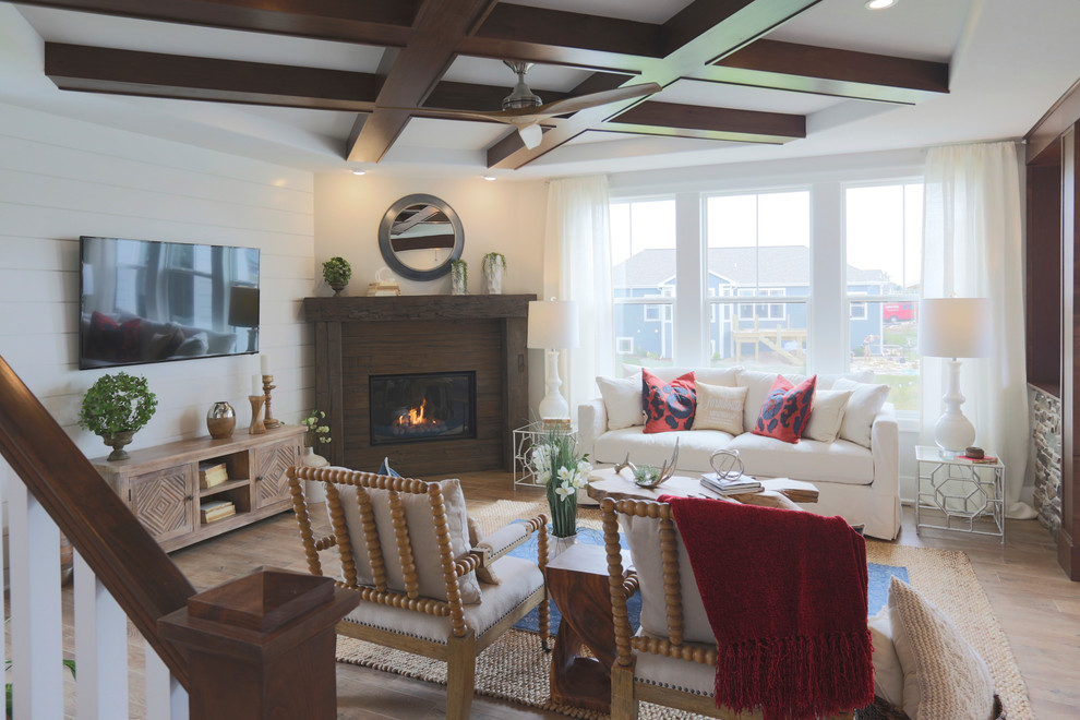 Photo of a rural open plan living room in Milwaukee with white walls, a corner fireplace, a concrete fireplace surround, a wall mounted tv and feature lighting.