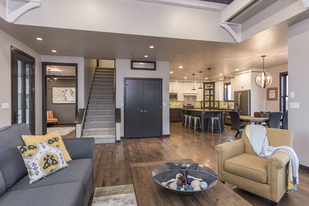 Cottage formal and open concept medium tone wood floor and brown floor living room photo with a tile fireplace, beige walls, a standard fireplace and no tv
