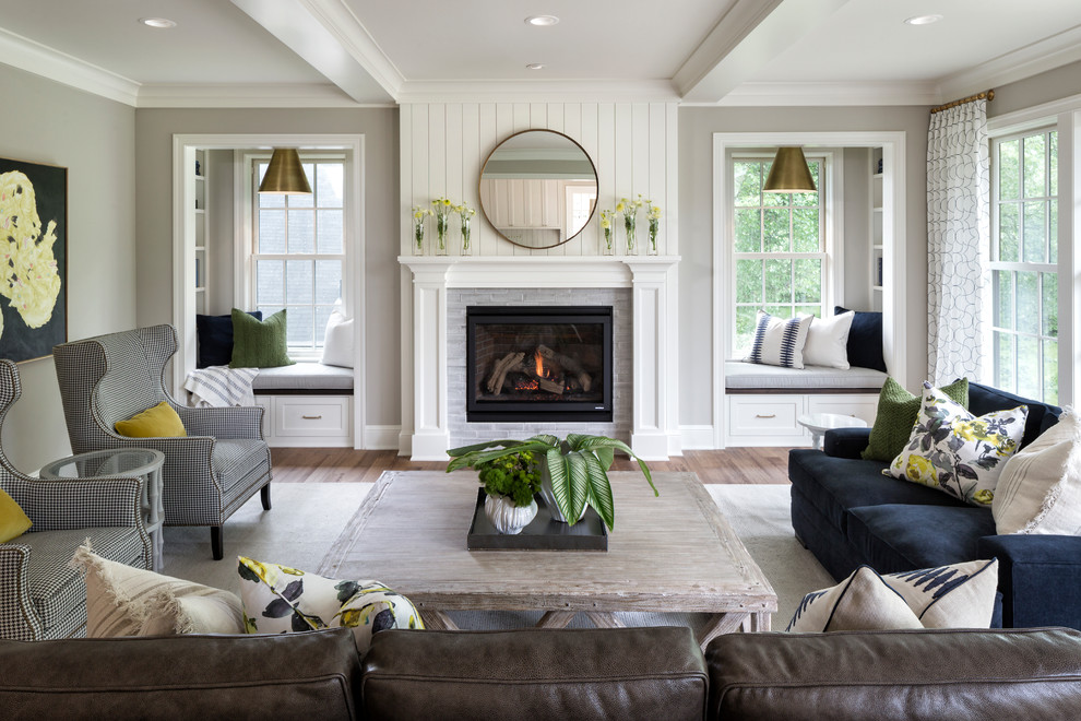 Design ideas for a nautical formal living room in Minneapolis with grey walls, light hardwood flooring, a standard fireplace and a tiled fireplace surround.