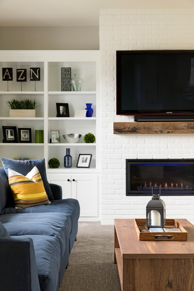 Mid-sized open concept carpeted and beige floor living room photo in Minneapolis with gray walls, a ribbon fireplace, a brick fireplace and a media wall