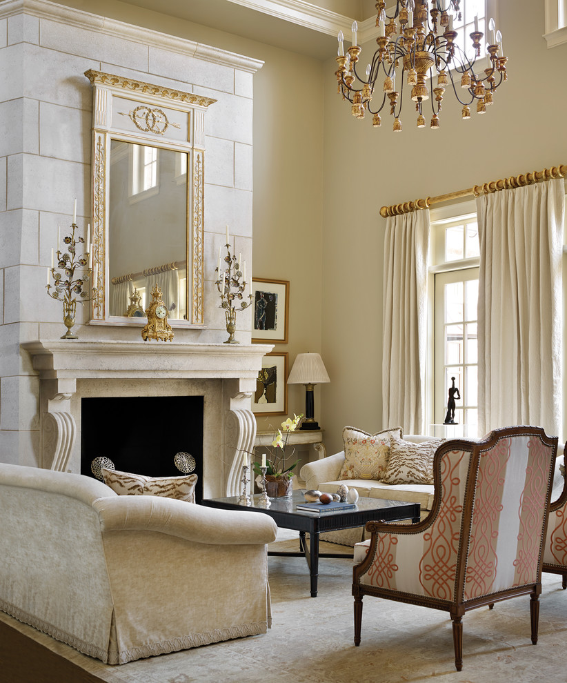 This is an example of a large classic formal enclosed living room with beige walls, dark hardwood flooring, a standard fireplace, a stone fireplace surround, no tv and brown floors.