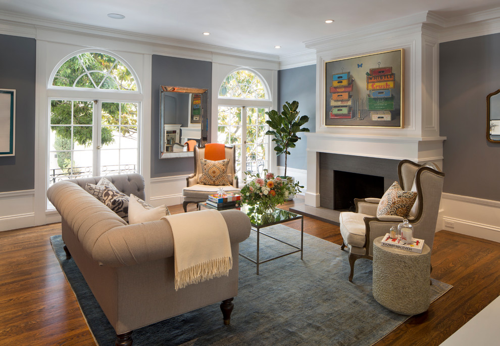 Classic living room in San Francisco with grey walls, dark hardwood flooring and a standard fireplace.