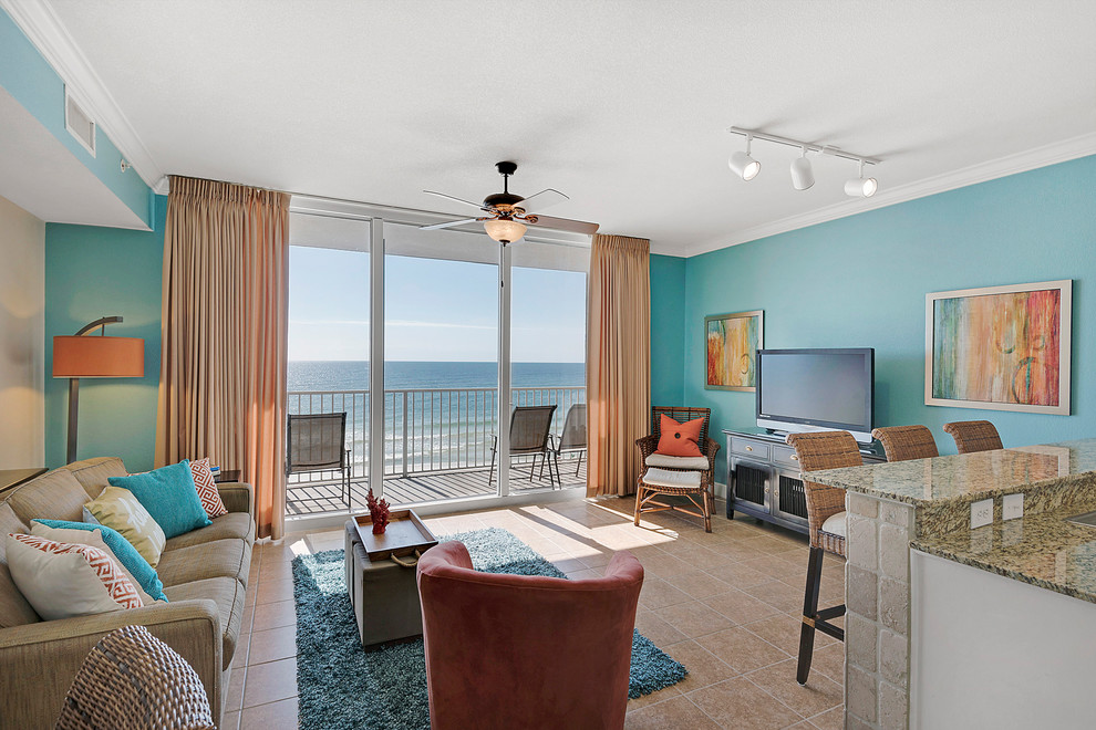 Design ideas for a coastal open plan living room in Miami with blue walls, porcelain flooring and feature lighting.