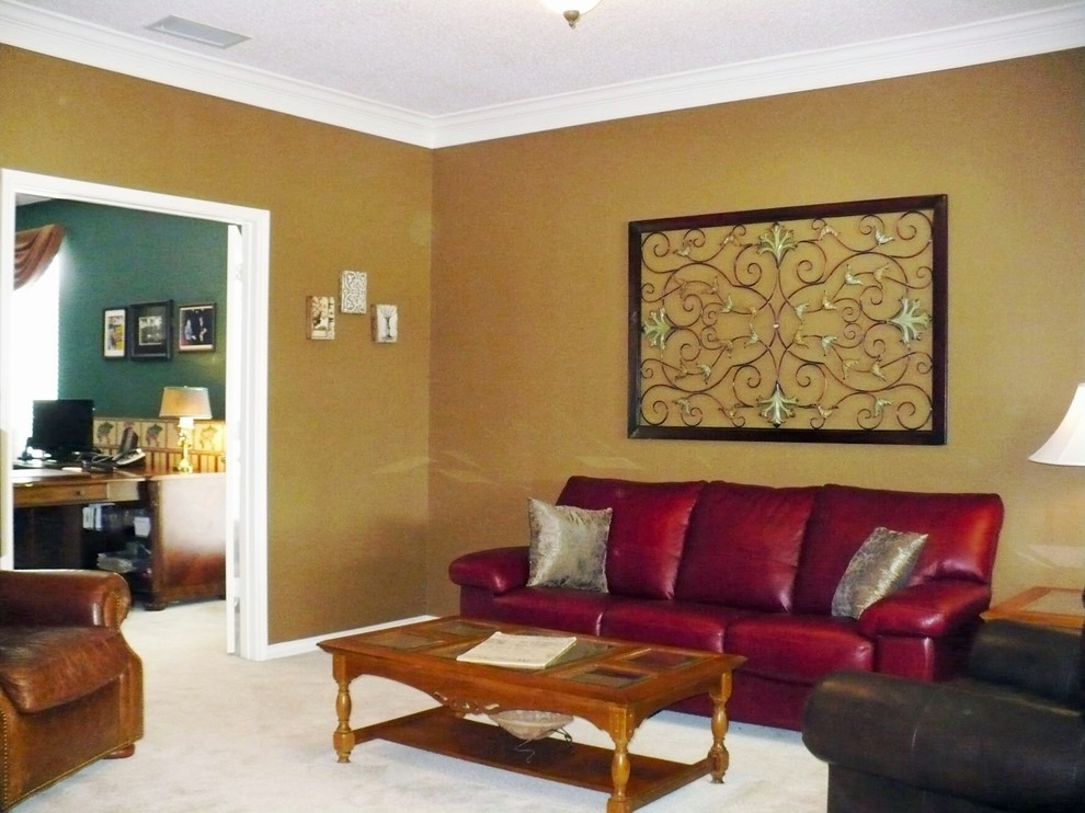 Photo of a classic formal enclosed living room in Dallas with brown walls and carpet.