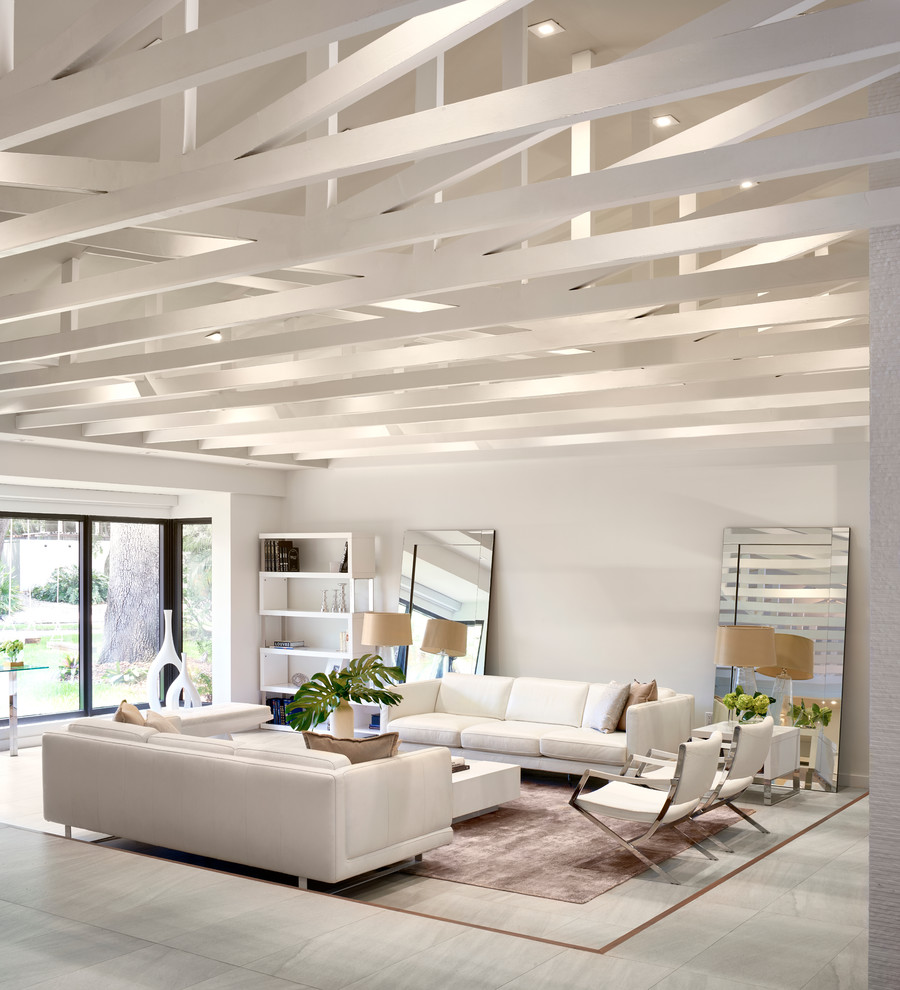 Immagine di un soggiorno design di medie dimensioni con pareti bianche e pavimento con piastrelle in ceramica
