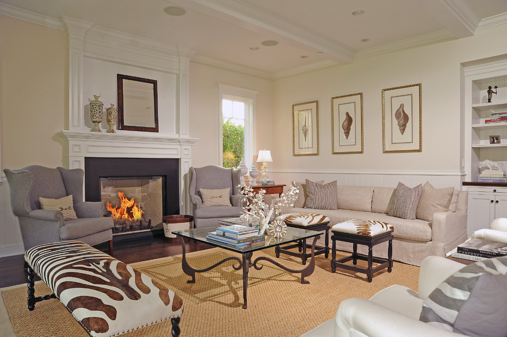 Inspiration for a timeless living room remodel in Los Angeles with beige walls and a standard fireplace