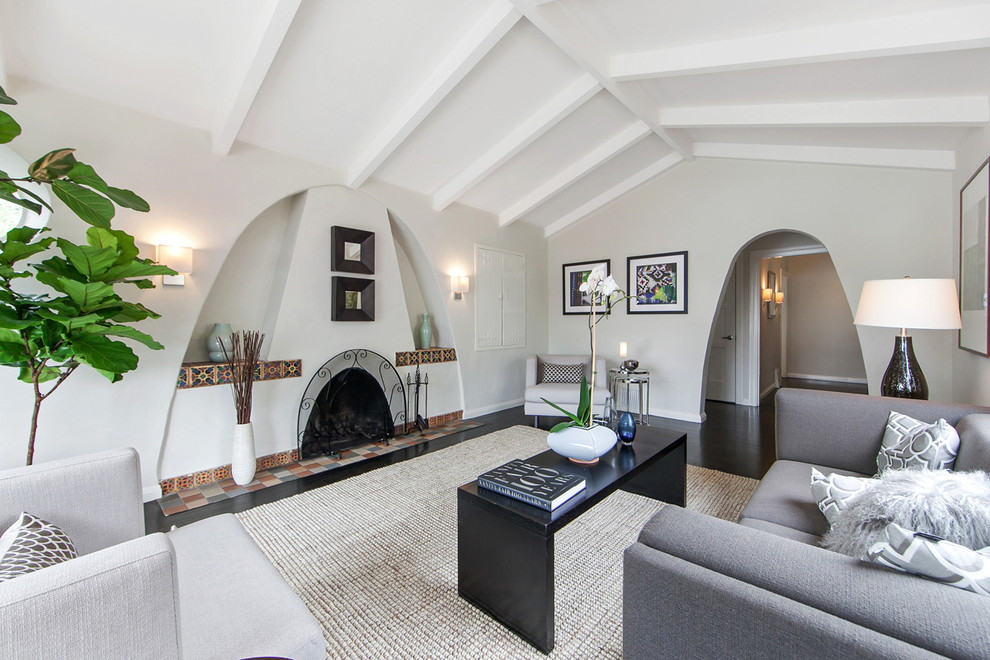 Inspiration for a mediterranean formal and enclosed dark wood floor living room remodel in San Francisco with gray walls and a standard fireplace