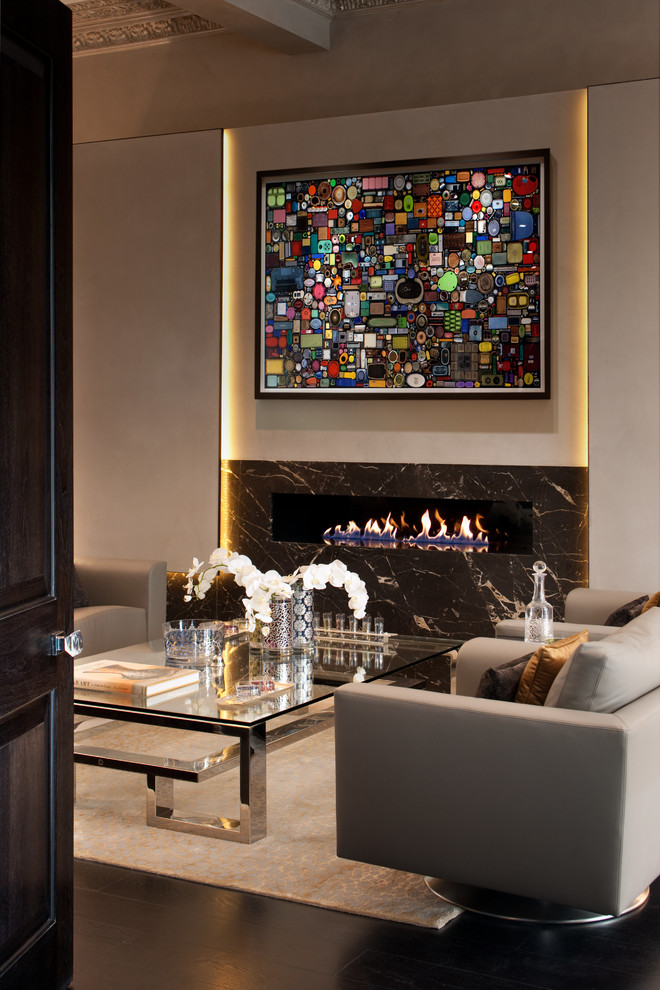 Contemporary formal living room in London with white walls, a ribbon fireplace and a stone fireplace surround.