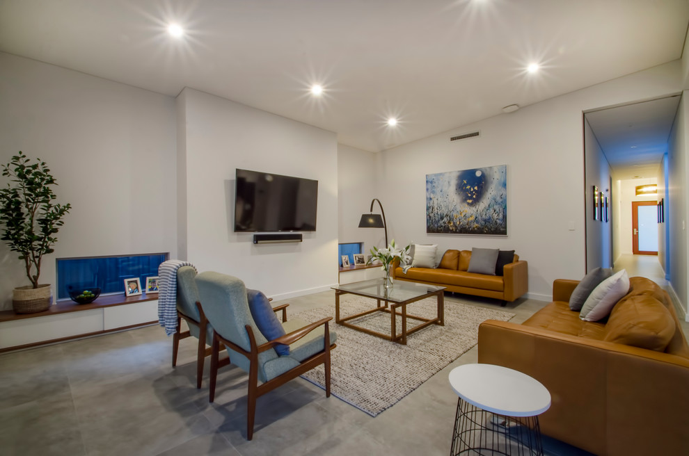 Свежая идея для дизайна: открытая гостиная комната среднего размера в современном стиле с белыми стенами, телевизором на стене, серым полом, полом из керамической плитки и коричневым диваном без камина - отличное фото интерьера