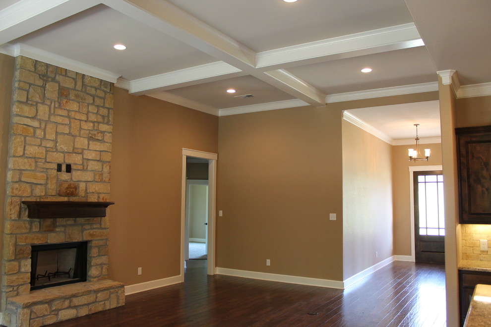 Inspiration for a large classic open plan living room in Dallas with beige walls, dark hardwood flooring, a standard fireplace, a stone fireplace surround and a wall mounted tv.