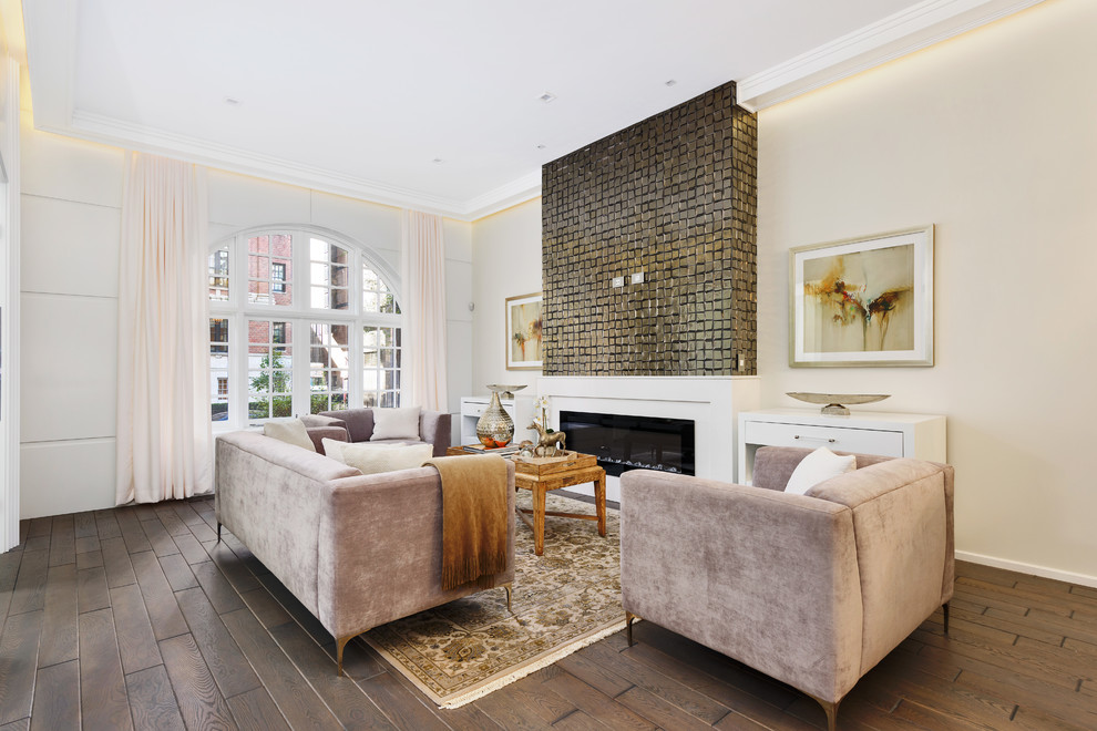 This is an example of a contemporary living room in Chicago with beige walls and a ribbon fireplace.