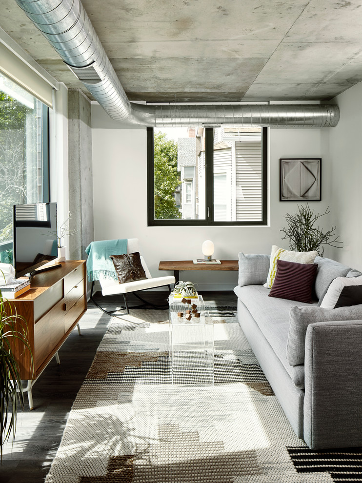 Example of a small minimalist open concept dark wood floor living room design in Chicago with white walls, no fireplace and a tv stand
