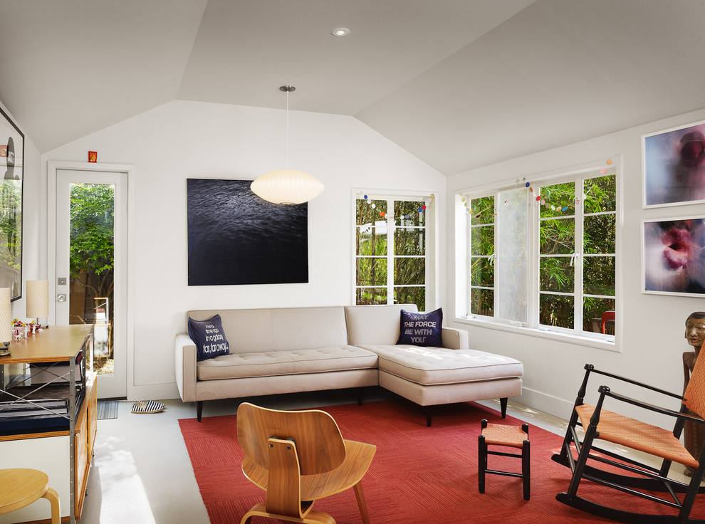Minimalist concrete floor living room photo in Austin