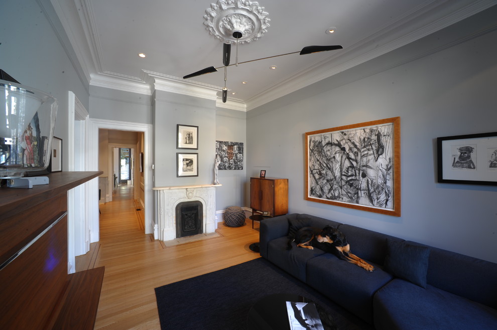 Example of a trendy living room design in San Francisco with gray walls
