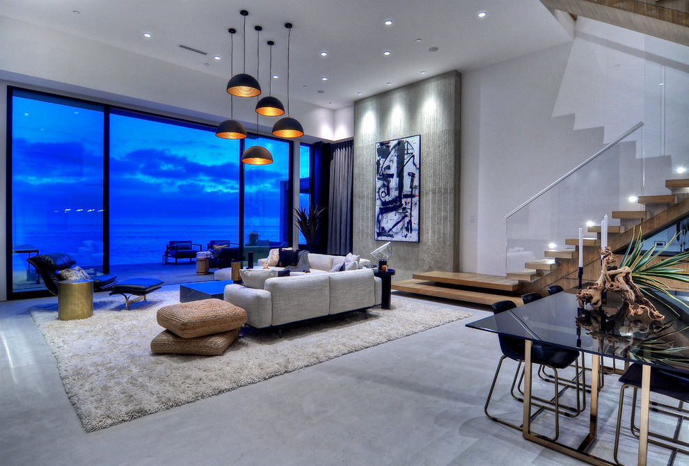 Design ideas for an expansive contemporary open plan living room in Orange County with a wall mounted tv.