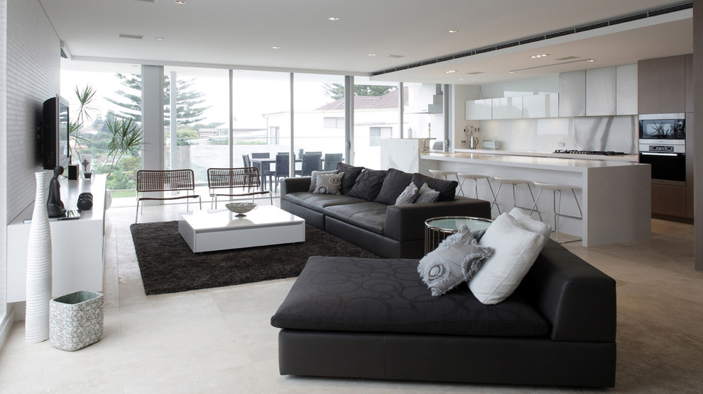 Идея дизайна: открытая гостиная комната в современном стиле с белыми стенами и бетонным полом