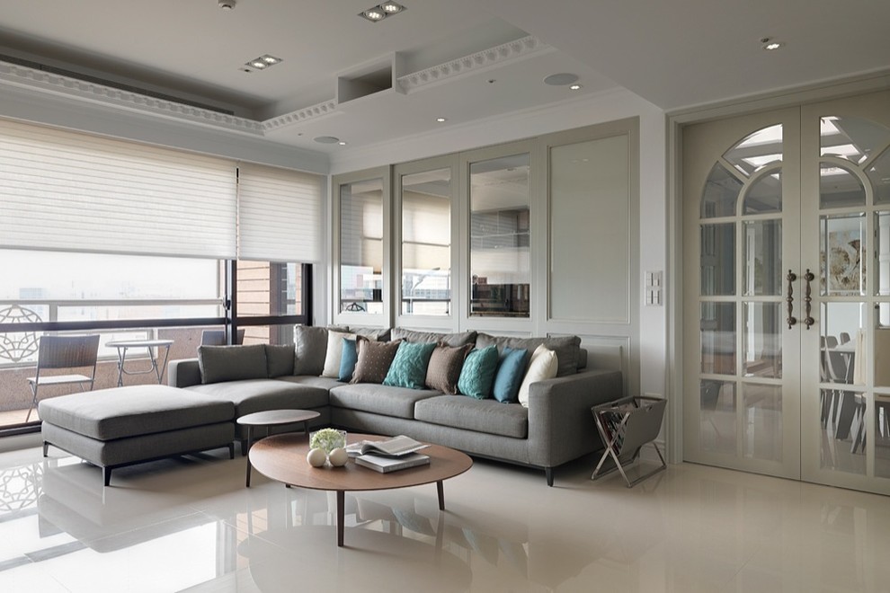 Traditional grey and teal living room in Singapore with white walls.