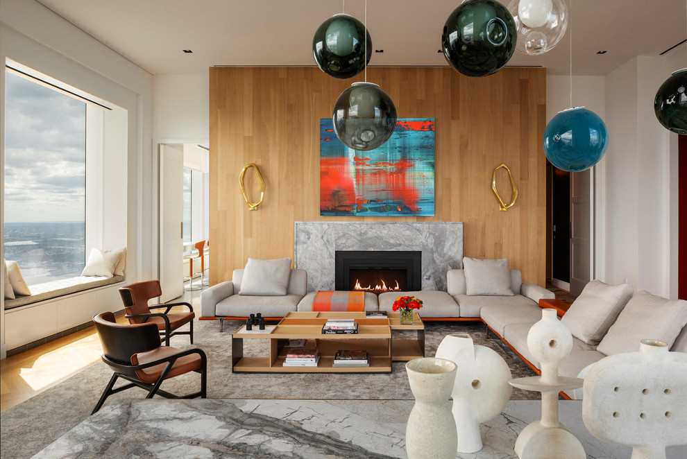 Inspiration for a contemporary formal and open concept light wood floor living room remodel in New York with white walls, a ribbon fireplace, a stone fireplace and no tv