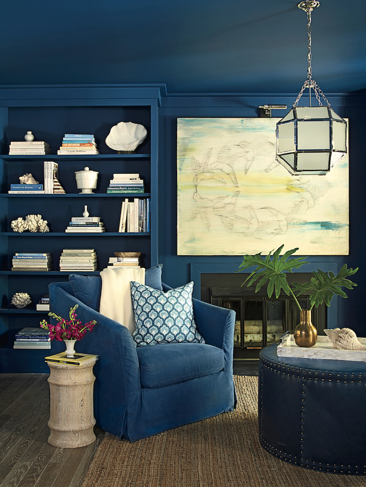 Design ideas for a medium sized nautical enclosed living room in Miami with a reading nook, blue walls, medium hardwood flooring, a standard fireplace, a metal fireplace surround and no tv.